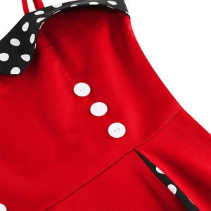 Detail view of red 50s vintage dress with white buttons and black polka dot lapel