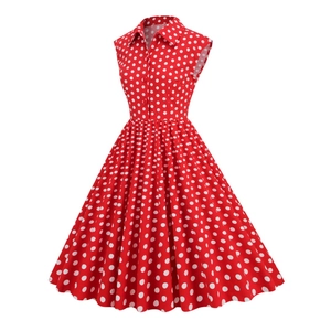 Detailed view of the 1950s red polka dot dress featuring a lapel collar and button closure