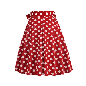 Detail view of the red vintage A-line skirt with white polka dot patterns and pleats