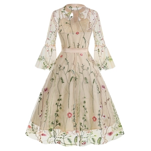 Detail view of the embroidered mesh back and flared sleeves on this vintage gothic dress