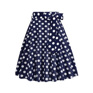 Detailed view of high waisted navy blue polka dot A-line skirt with a matching bow tie belt