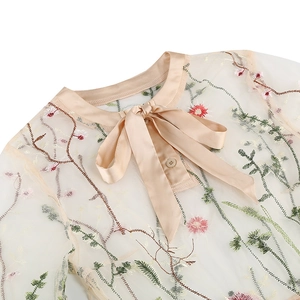 Detailed embroidery on white mesh fabric with champagne satin bow collar design