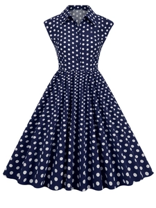 Detail view of the vintage 1950s navy blue polka dot dress with collar and buttons