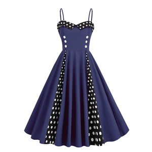 Navy blue 50s vintage A-line dress with white polka dot details and decorative buttons