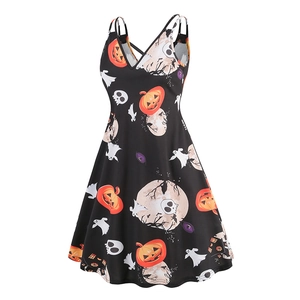 Close-up of Halloween print on V-neck dress featuring pumpkins, ghosts and skulls