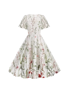 White mesh dress with colorful floral embroidery, crew neck, and ruffled short sleeves