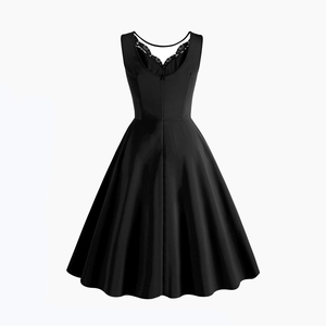 Detail of elegant black lace trimming on the back V-neck of a sleeveless A-line dress