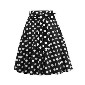 Classic black and white polka dot A-line skirt with a high waist large bow belt