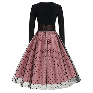 Rear view of long sleeve dress with polka dot mesh overlay and pink satin lining