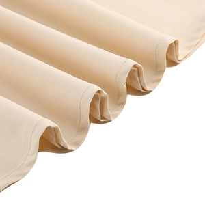 Close-up of fine stitching and hem detail on beige mesh embroidery gothic dress