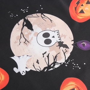 Macro view of Halloween V-neck dress fabric with pumpkin, bat, and ghost prints