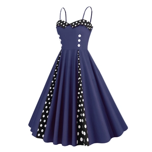 Detail of retro navy dress showing polka dot sweetheart neckline and white button accents