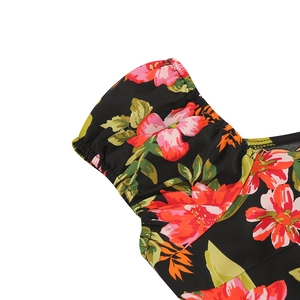 Detail of floral puff sleeves with elastic cuffs on a vintage Hepburn style dress