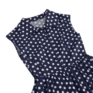 Detailed view of navy blue polka dot vintage dress with lapel collar and buttons
