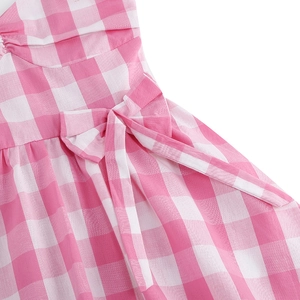 Pink and white gingham summer dress for girls featuring a sweet decorative bow detail