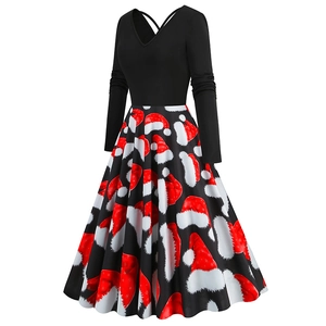 Detail of Christmas A-line dress featuring V-neck bodice and festive Santa hat prints