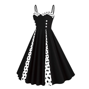 Detail view of 50s vintage black dress with polka dot trim and decorative white buttons