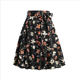 Detail of A-line floral skirt featuring a matching waist belt and colorful blossoms