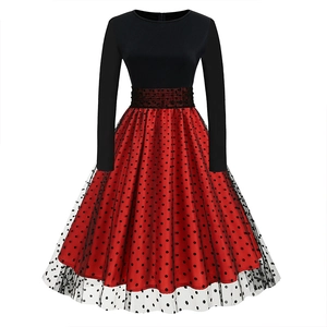 Detail of red skirt with black polka dot mesh overlay and spliced long sleeve bodice