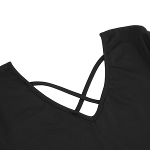 Close-up of the elegant V-neck design with crisscross strap detail on a black dress
