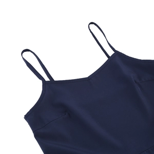 Detail of dark blue vintage gothic dress showing delicate thin shoulder straps and V-neckline