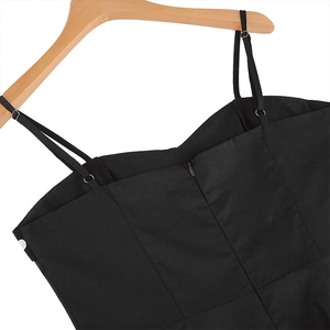 Detail of adjustable straps and back hidden zipper on a vintage polka dot flare dress