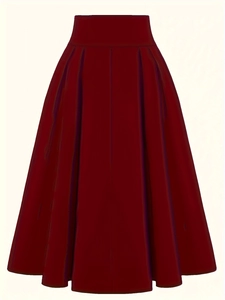 Detailed view of dark red pleated midi skirt with slimming high waist and A-line silhouette