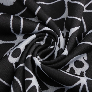 Detailed macro shot of gothic spider web pattern on soft stretch Halloween dress fabric