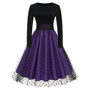 Detail of vintage puff dress with black bodice and purple polka dot mesh skirt