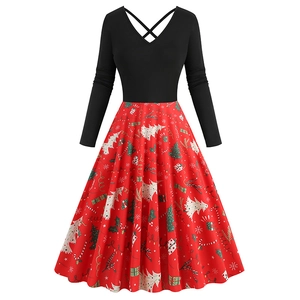 Detail of Christmas dress featuring V-neck lace-up design and festive holiday tree prints