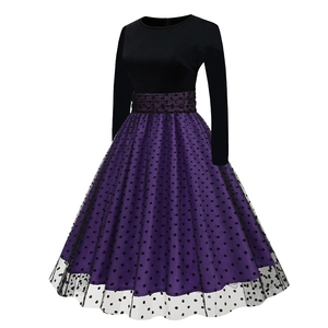 Detailed macro view of the double-layered purple skirt with black polka dot mesh overlay