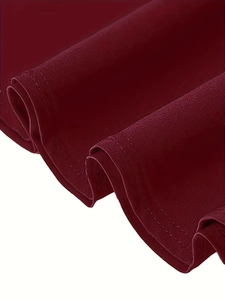 Detail of burgundy vintage skirt showing high-quality stitching and textured fabric