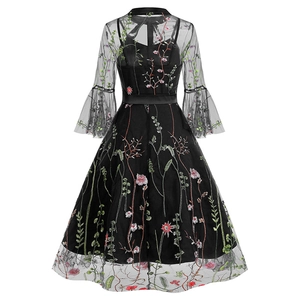 Detailed back view of gothic mesh dress with intricate floral embroidery and satin waist belt
