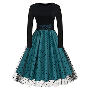 Detail of vintage high-waisted black bodice and polka dot mesh layered dress skirt
