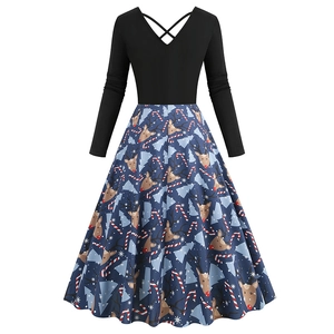 Detail of Christmas dress with reindeer print, snowflakes and a deep V-neckline