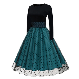 Detail of A-line layered skirt with green base and black polka dot tulle overlay