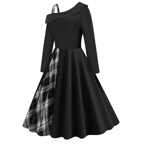 Detail of asymmetrical neckline with checkered strap on black A-line dress