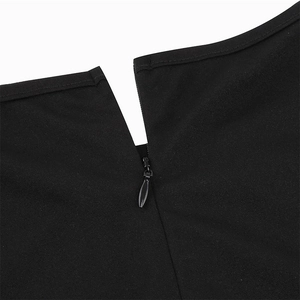Detailed close-up of a black invisible water-drop zipper on plain weave fabric skirt