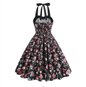 Detail of vintage 50s halter neck dress with pink rose floral print and back bow tie design