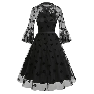 Detailed back view of gothic black mesh dress with embroidered butterfly patterns