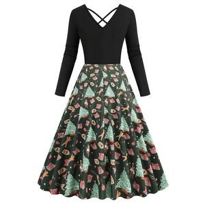 Detail of V-neck Christmas dress with lace-up back and festive pattern on the skirt