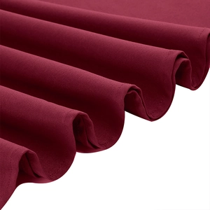 Detailed macro view of the wine red mesh stitching and fine fabric texture on the dress