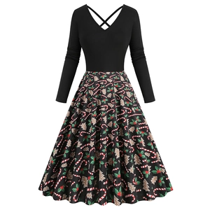 Detail of V-neck Christmas vintage dress featuring candy cane and tree prints