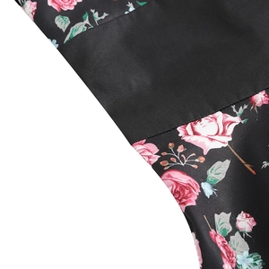 Close-up of pink rose floral print on black vintage dress with premium stitching detail
