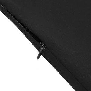 Close-up of a high-quality invisible zipper on a black textured fabric dress