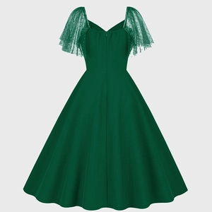 Detail view of the deep green vintage A-line dress with polka dot mesh sleeves and back zipper