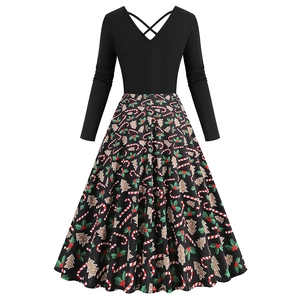 Detail of the cross-back V-neck design and festive Christmas print on a vintage dress