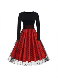 Women's long sleeve midi dress with red polka dot skirt and black mesh overlay layers