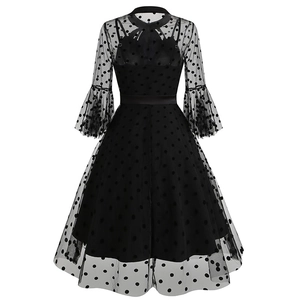 Detail view of the mesh back with polka dots and bell sleeves on this Gothic dress