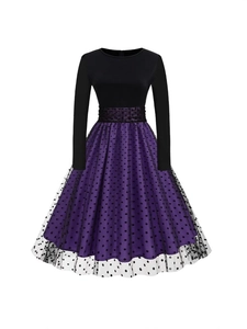 Elegant long sleeve dress featuring black knit bodice and purple polka dot mesh skirt
